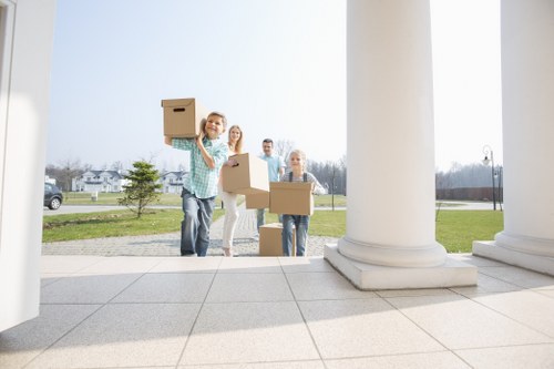 Organised office relocation with labeled equipment and furniture