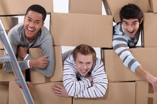Packed household boxes and furniture ready for a Woodford home removal service