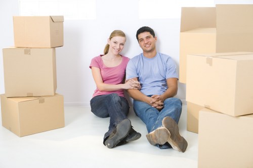 Man with a van loading furniture for a Woodford home move