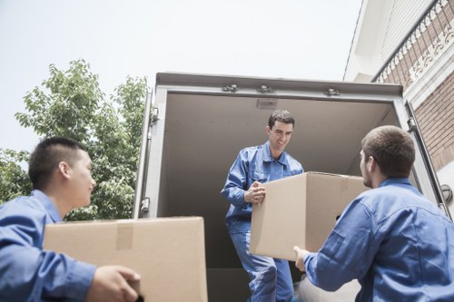 Removal team planning a house move in Woodford street setting