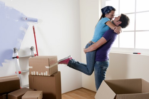 Movers transporting furniture safely during a home move in Woodford
