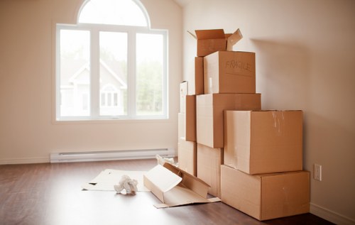 Local office moving team loading items in Woodford