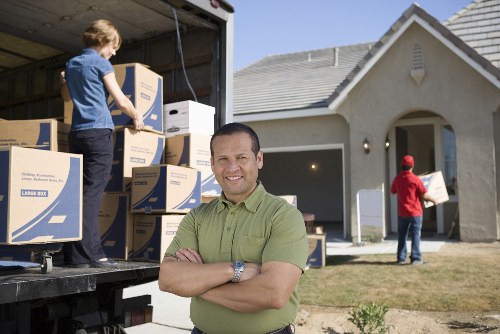 Furniture pick-up team collecting bulky household furniture in Woodford