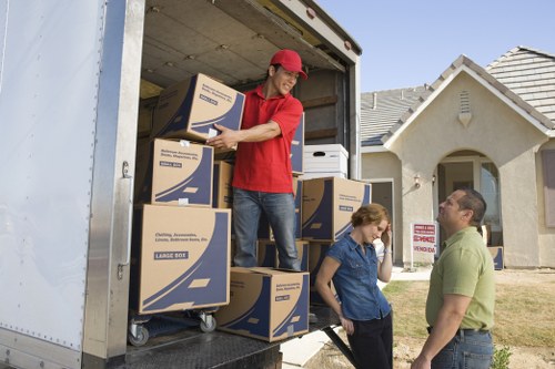 Packing boxes and furniture for a Woodford house removal