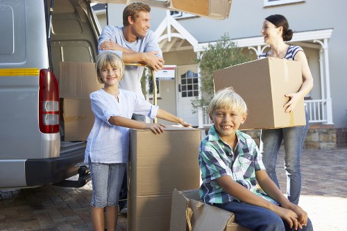 Packed boxes and furniture ready for a removal service in Woodford