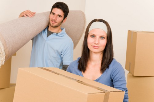 Professional moving team handling boxes and household items