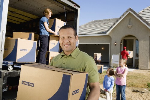 Insured Woodford man with van service protecting belongings with careful handling