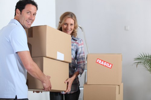 Local furniture removal service handling sofas and beds in a Woodford home